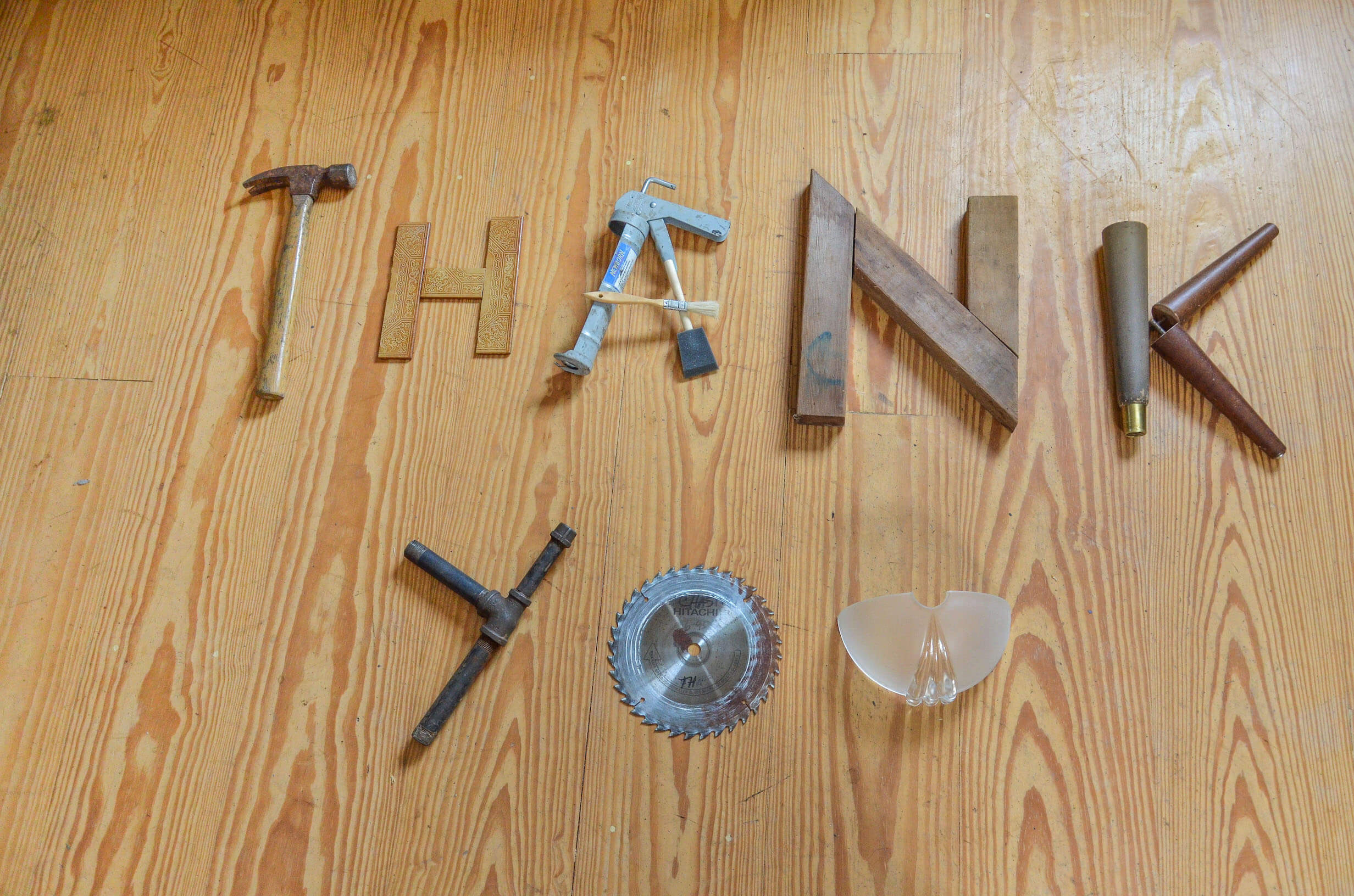 Reused materials arranged to spell thank you