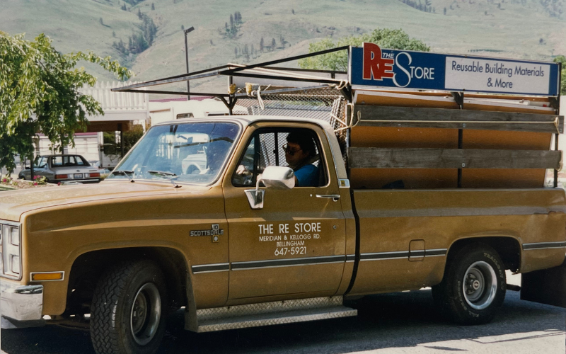 Photograph of Bruce Odom in our truck named 'Goldie'.